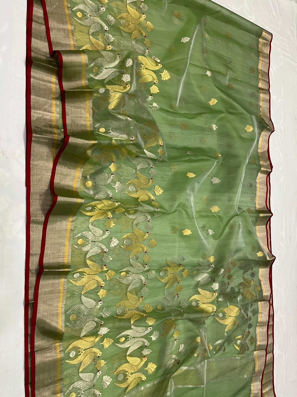 Green color with Peacock design and golden border Chanderi Saree